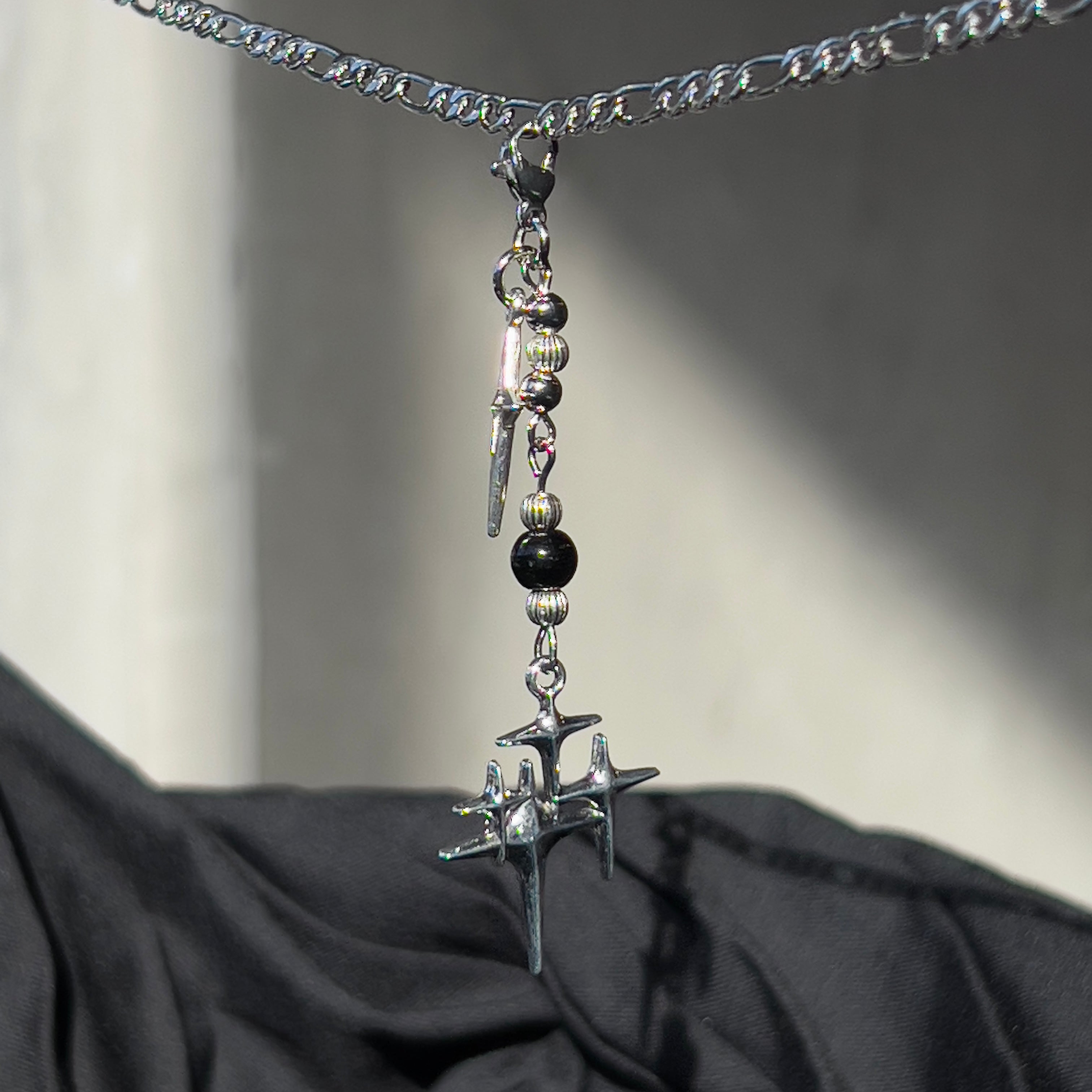 black star chain charm