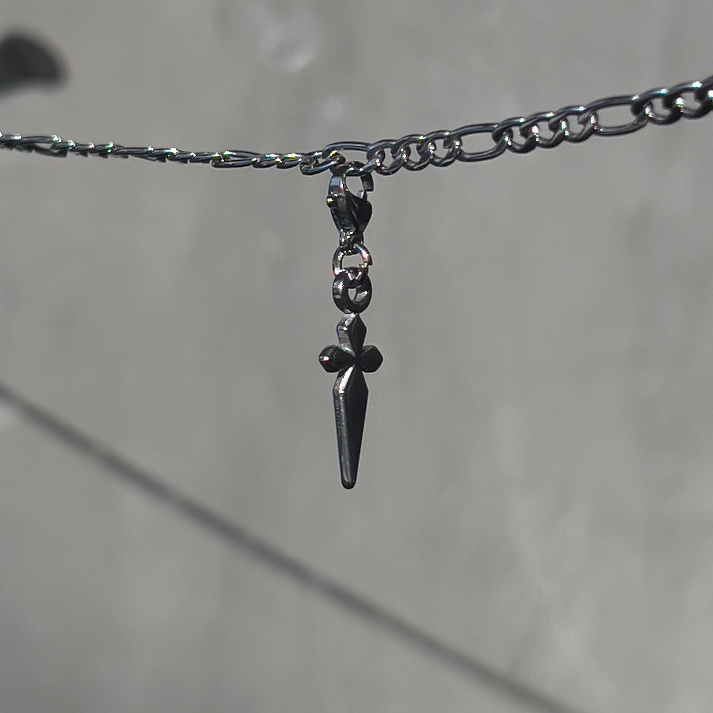 "back in black" cross charm